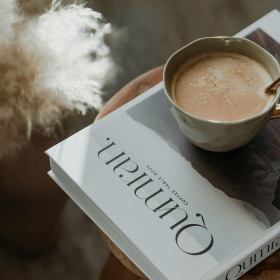 a cup of coffee on a book